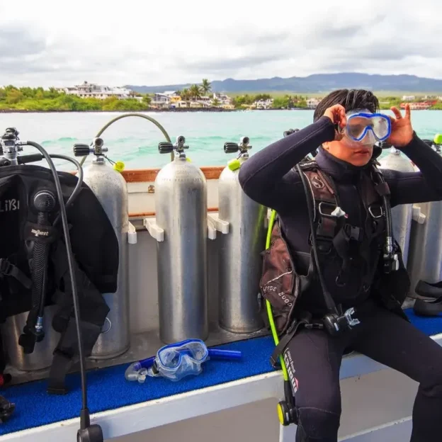 Group of divers preparing on the boat for diving in Mosquera