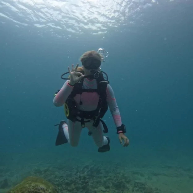 Diver floating in clear water during dive in North Seymour