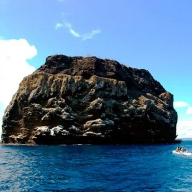 View of Daphne Island in the Galapagos from the sea, an iconic volcanic formation