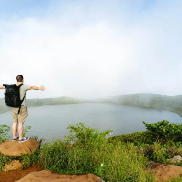 El Junco Lagoon covered in fog on a cloudy day