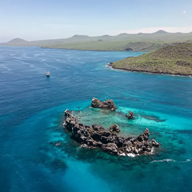 Aerial view of Enderby Island with crystal-clear waters in the Galapagos