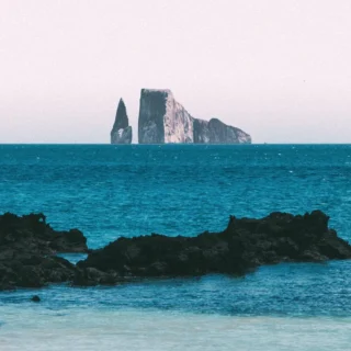 Panoramic view of the Sleeping Lion in the Galapagos, a rock formation emerging from the ocean
