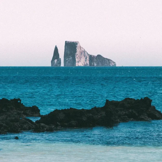 Panoramic view of the Sleeping Lion in the Galapagos, a rock formation emerging from the ocean