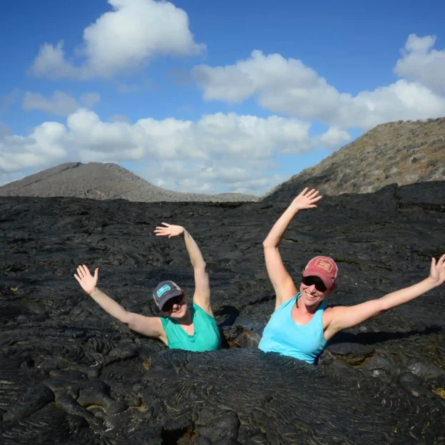 Tourists hiking trails and birdwatching in North Seymour, Galapagos