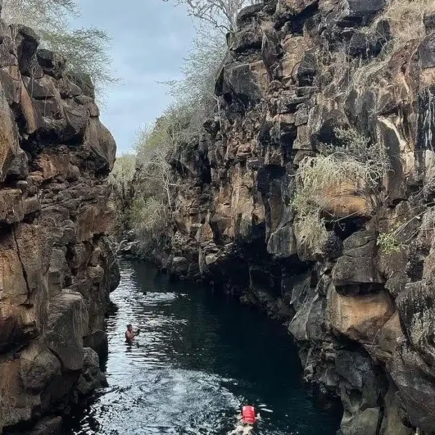 Natural crevice with crystal-clear water on the Bahia Tour, Galapagos Natural crevice with crystal-clear water on the Bahia Tour, Galapagos